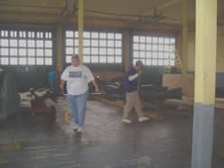 Volunteers clean boathouse.